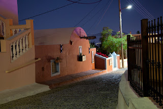 Colorful architecture in the town of Firastefani, Santorini Greece at night 