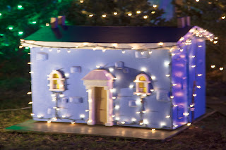 A mineature house with lights as part of the Trail of Lights in Austin, Texas