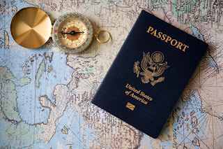 Passport and compass against a map background, Cedar Park, Texas, USA 