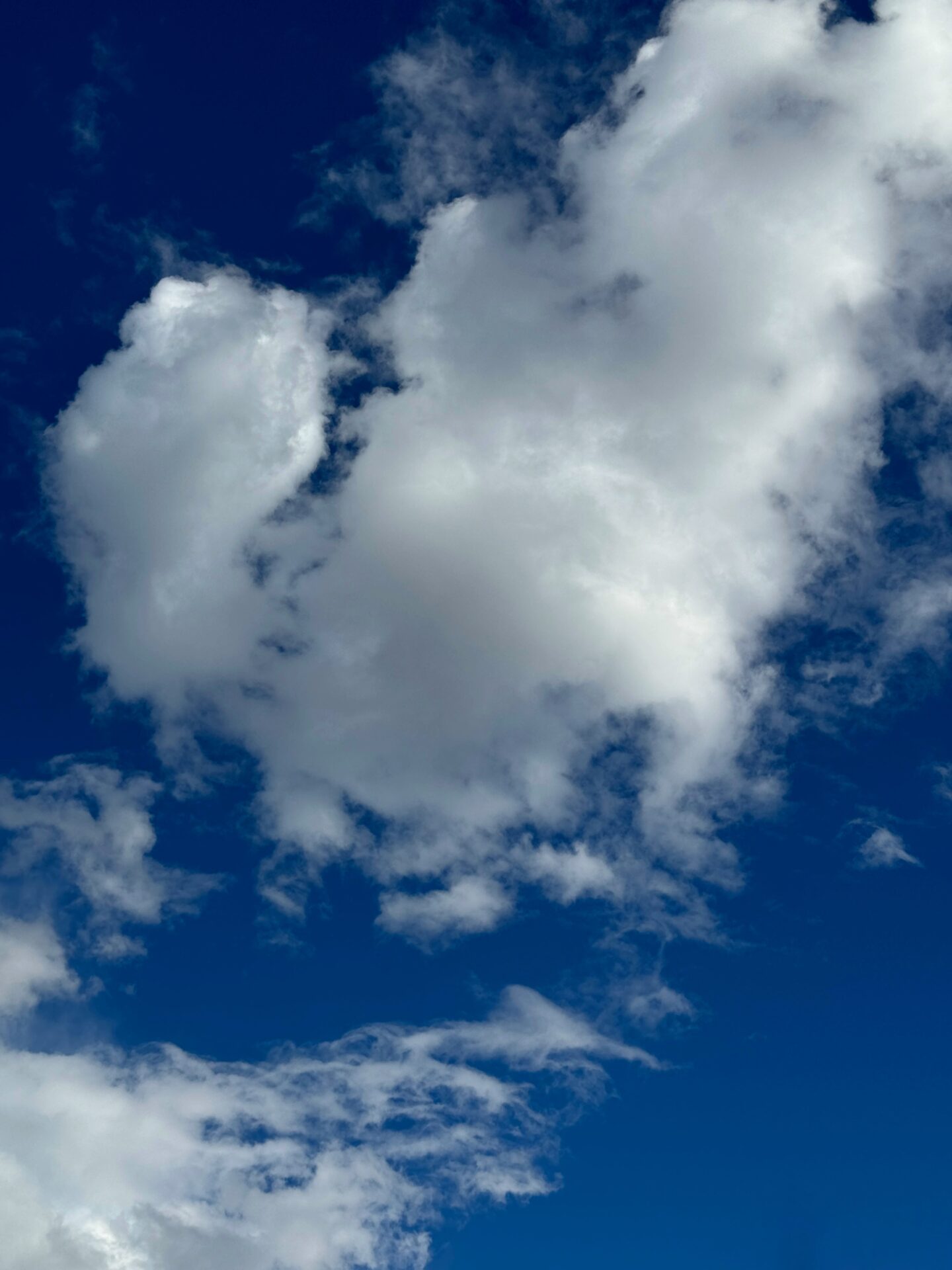 Blue sky with clouds, an image by photographer Carol Schiraldi of Carol's Little World, as shot on the iPhone 15 Pro Max