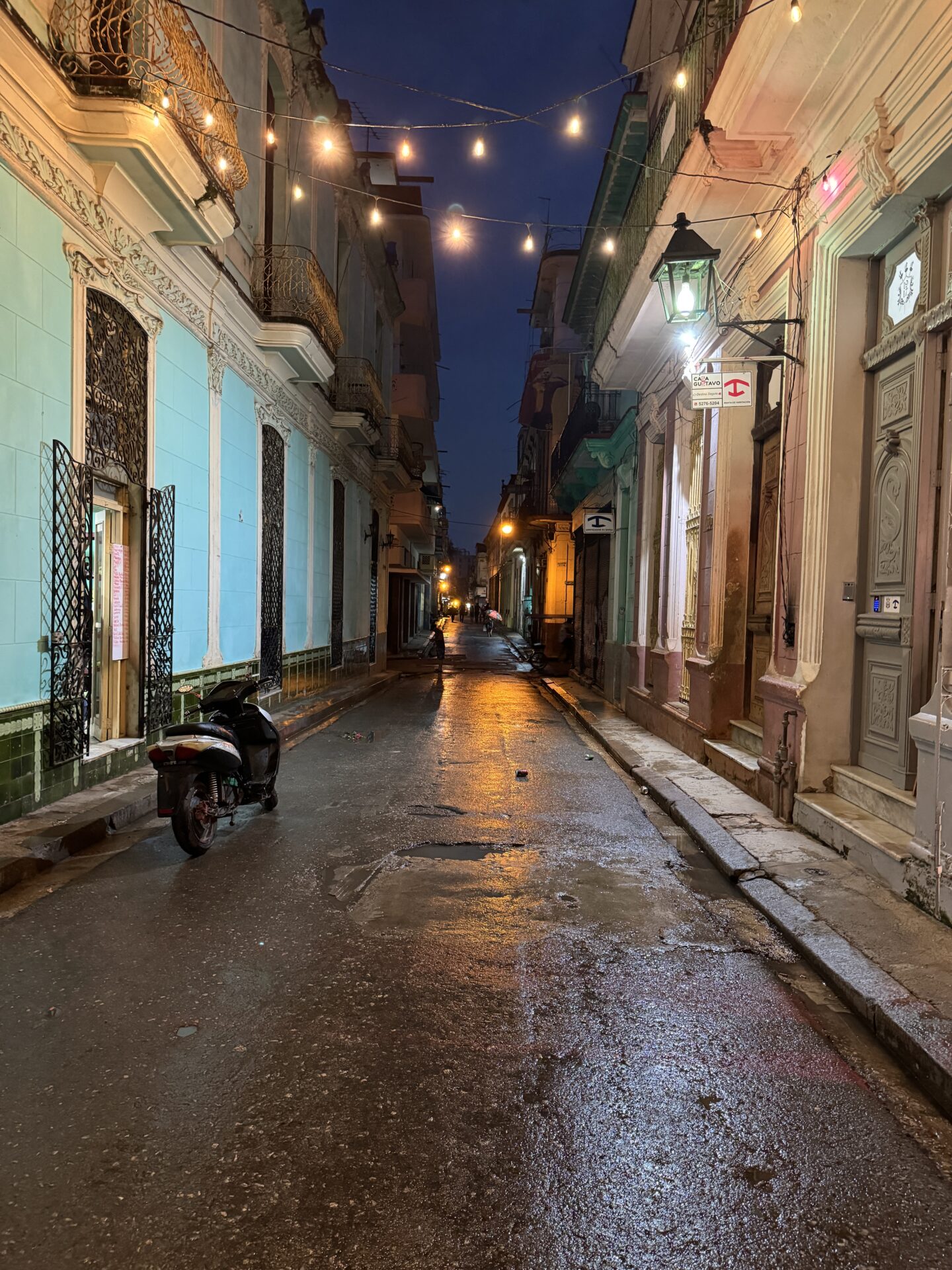 Twinkle lights across a narrow side street in Old Havana, Cuba by Carol Schiraldi of Carol's Little World 