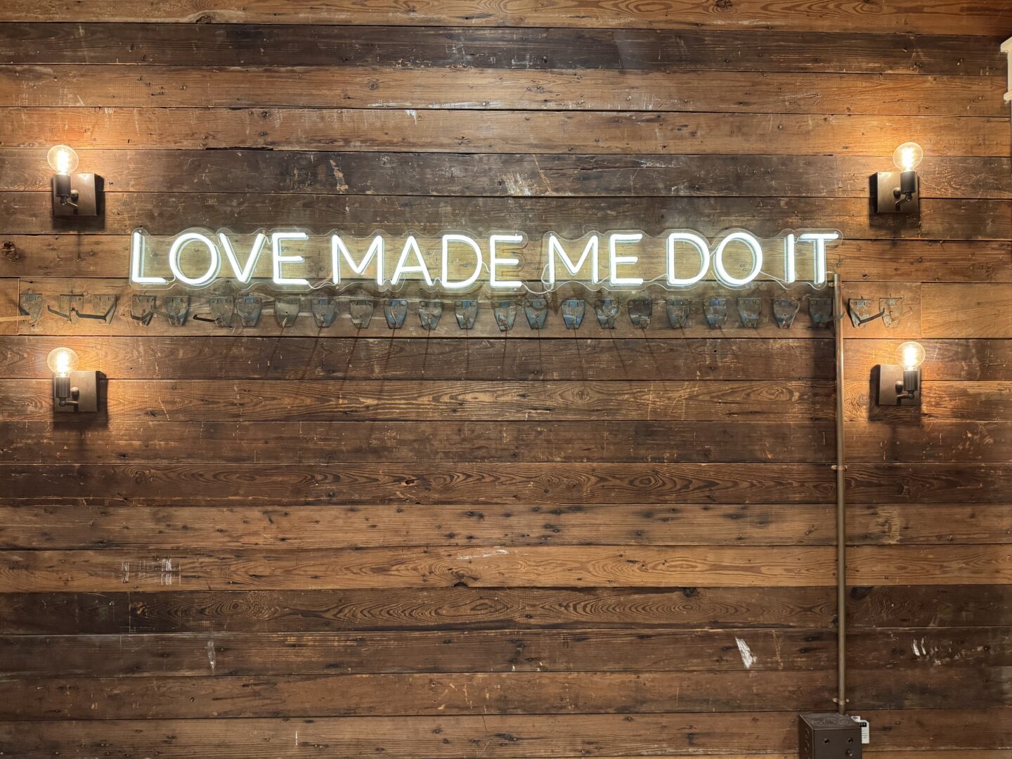 Love made me do it neon sign from Georgetown square photographed as part of the Texas Photography Festival. 
