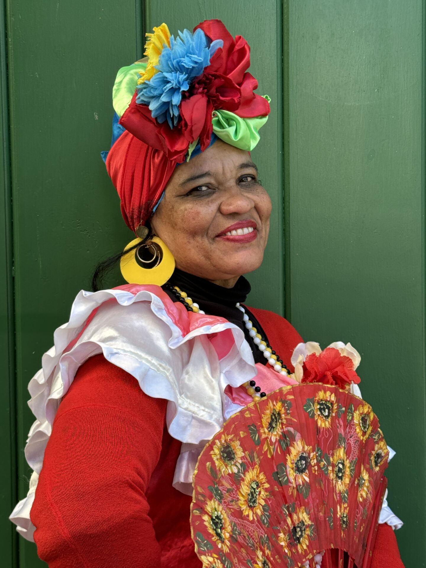A Cuban woman wearing traditional dress from Havana, as photographed by Carol Schiraldi of Carol's Little World. 