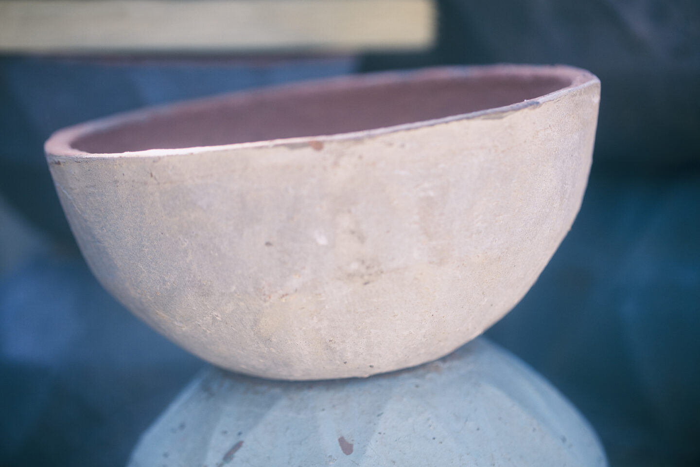 Potter's Bowl, a graphical study of a bowl perched on a stand, done with limited colors for "Chase the Light" by Carol Schiraldi 