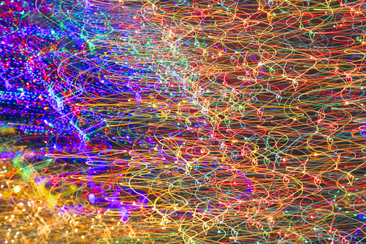 An abstract image resembling a flag made of light from the holiday light display in Round Rock Texas at Bent Brook Drive in Forest Creek. 