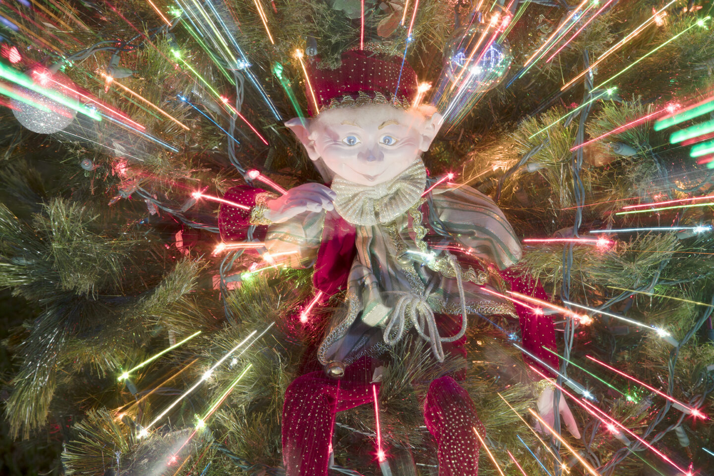 Magic Elf shows bursts of lights bringing a elf in a Christmas tree to life, from the Bent Brook holiday light display 