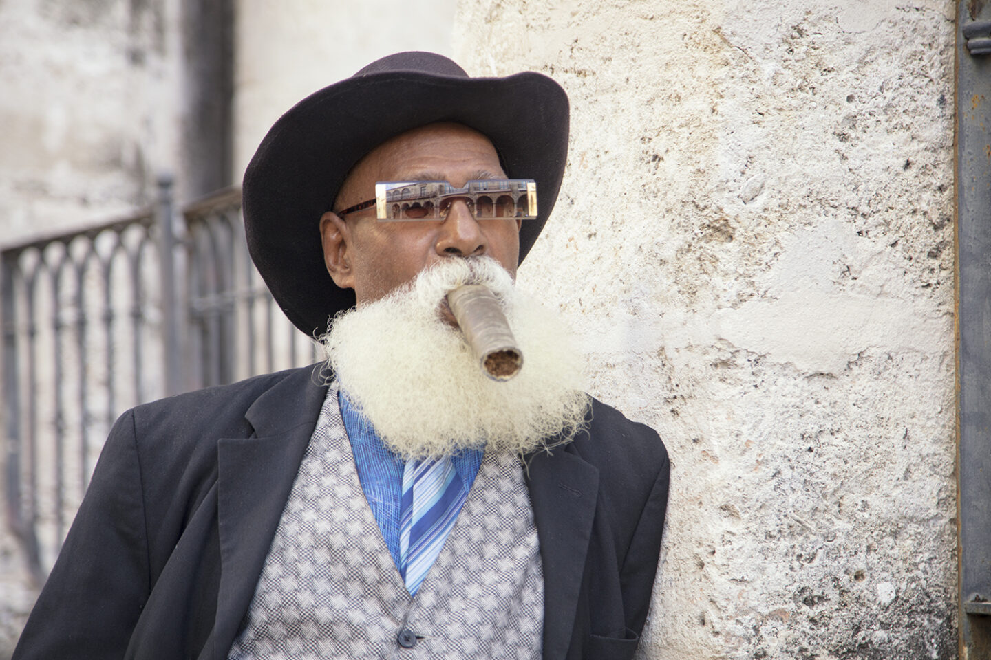 Portrait of a man with a cigar and a big beard, taken in the square in Havana Cuba from the Portraits of Cuba series 