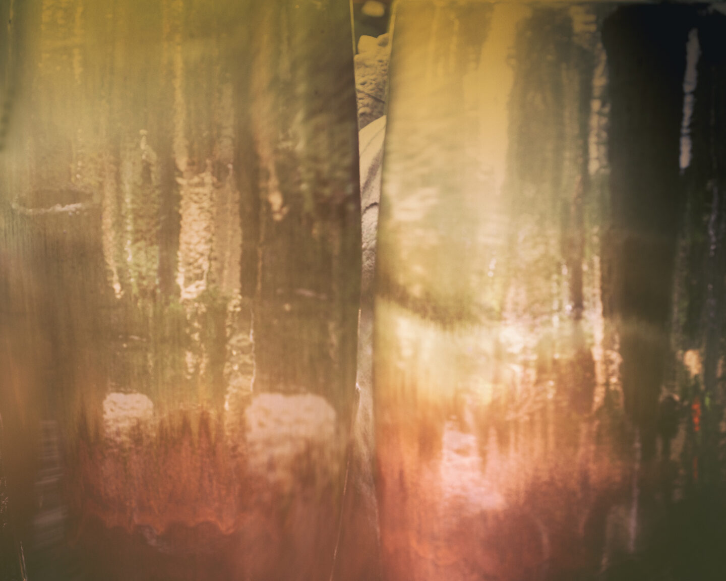 A reflection that appears to be like a flame from inside the Curiosity Factory 